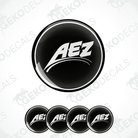 Set of four black vinyl decals with the AEZ logo in white, designed for use on vehicle wheels.