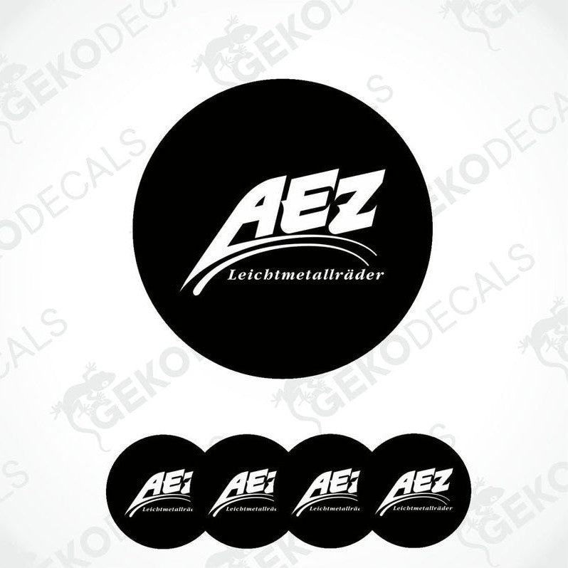 A set of four black and white vinyl decals with the AEZ LEICHTMETALLRÄDER logo.