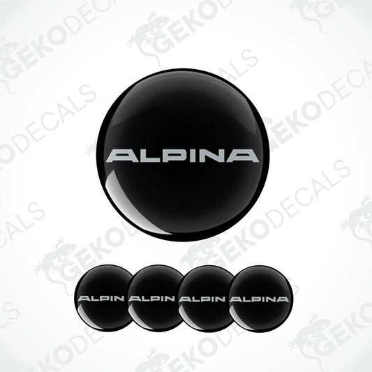 Set of four black vinyl decals with the 'ALPINA' brand name on them, intended for use on vehicle wheels.