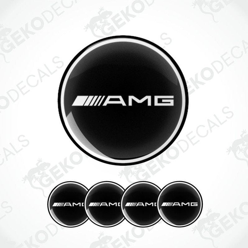 A set of four black vinyl stickers with the AMG logo, designed for use on car wheels.