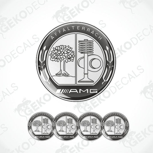 A set of four silver-colored vinyl stickers with a polyurethane coating, featuring the AMG logo and a design that includes a tree and a microphone.