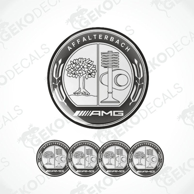A set of four silver-colored vinyl stickers with a geometric design featuring a tree, a microphone, and the AMG brand logo.