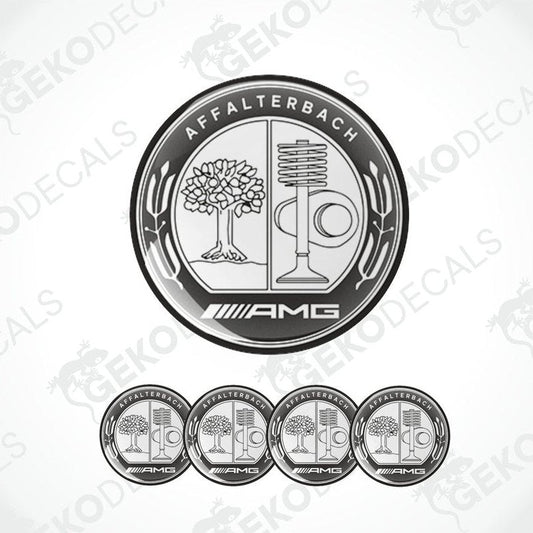 A set of four silver-colored vinyl stickers with a geometric design featuring a tree, a microphone, and the AMG brand logo.
