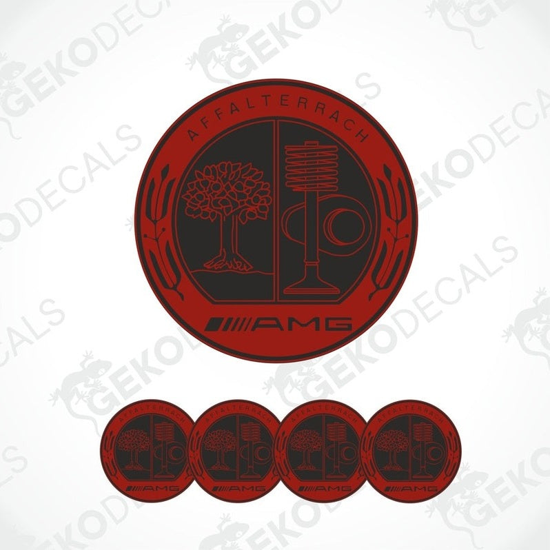A set of four red vinyl stickers with a geometric design and the word 'AMG' on them, arranged on a white background.