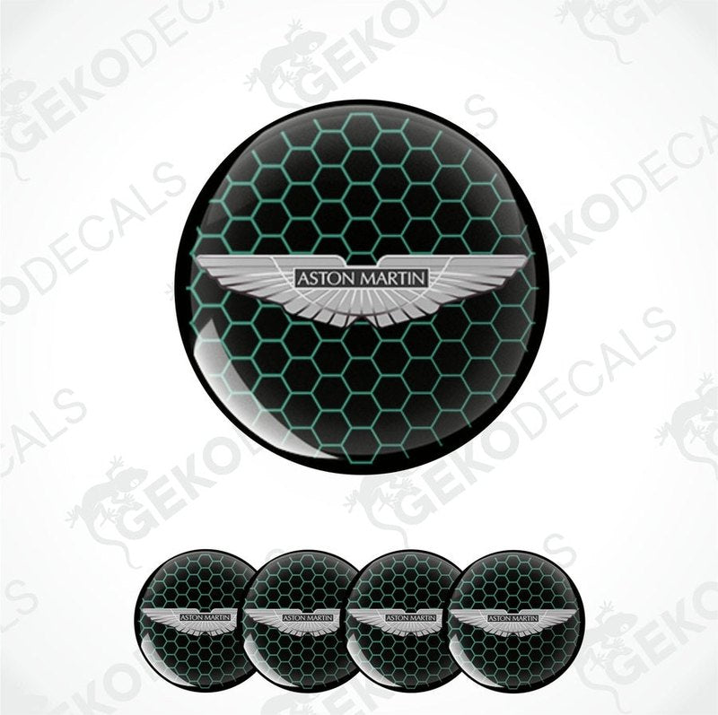 A set of four black vinyl stickers with a green pattern and the Aston Martin logo in the center.