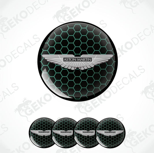A set of four black vinyl stickers with a green pattern and the Aston Martin logo in the center.