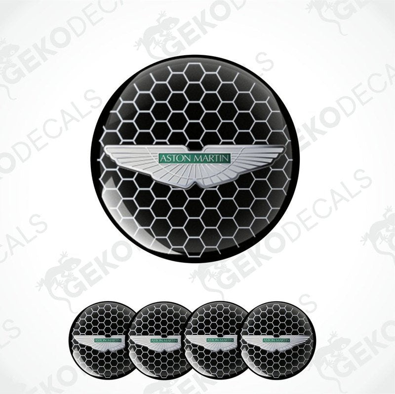 A set of four black vinyl stickers with the Aston Martin logo in the center.