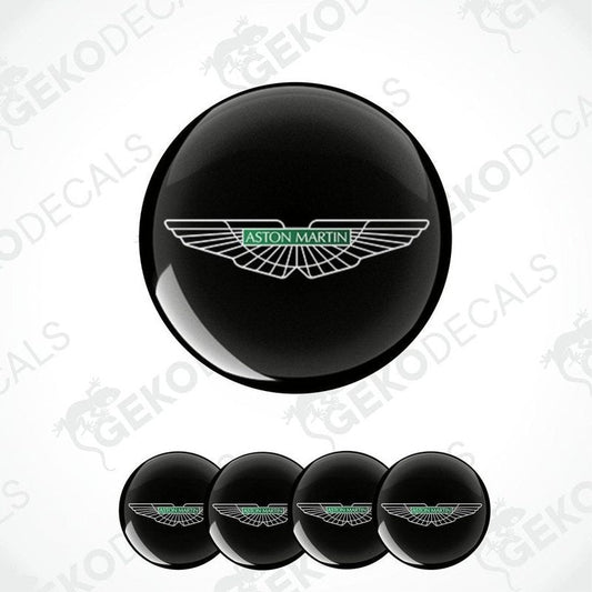 A set of vinyl decals with the Aston Martin logo applied on a black surface and shown in isolation against a white background.