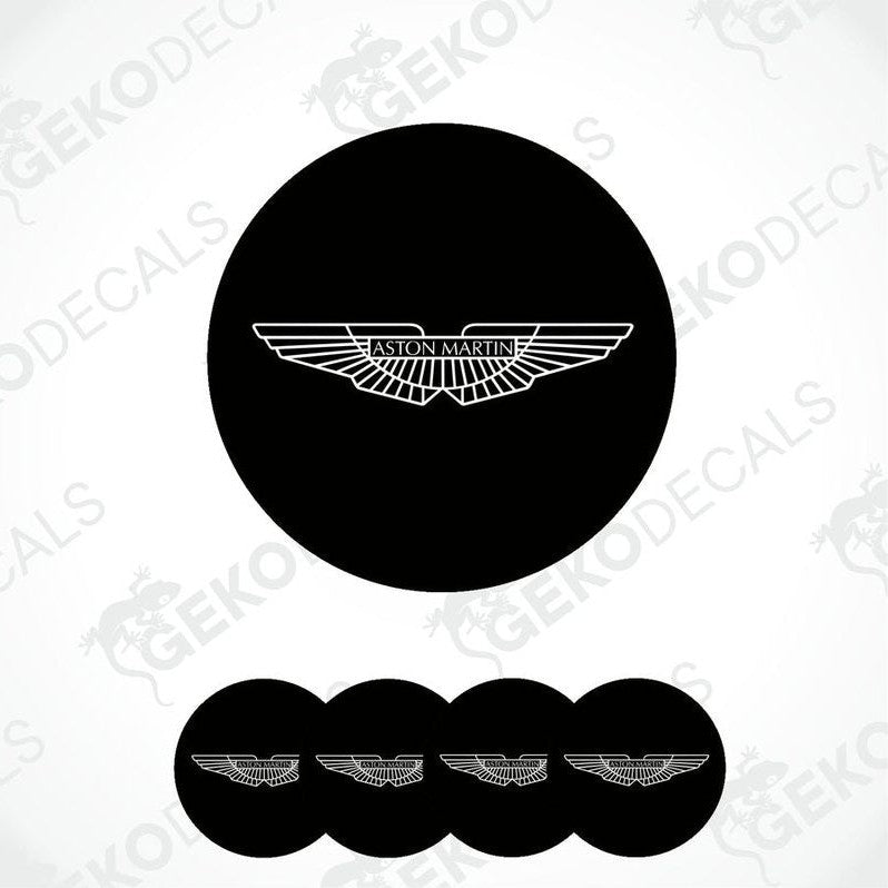 A set of four black vinyl stickers with a geometric design, including the Aston Martin logo.