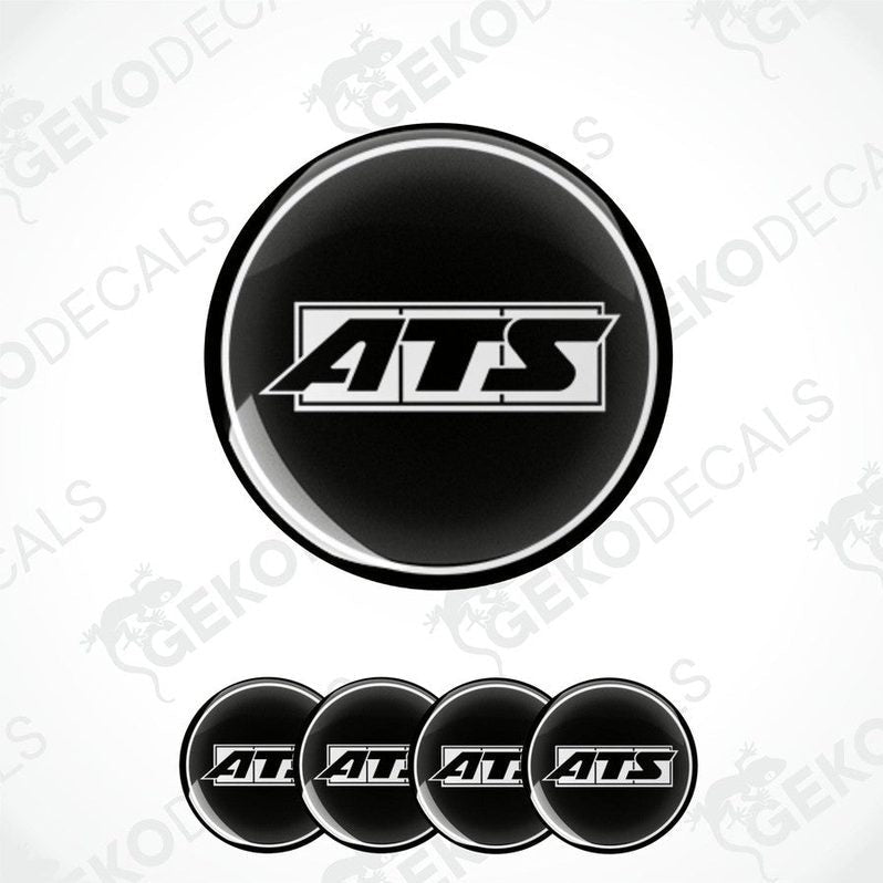 A set of four round black vinyl stickers with the ATS logo in white.