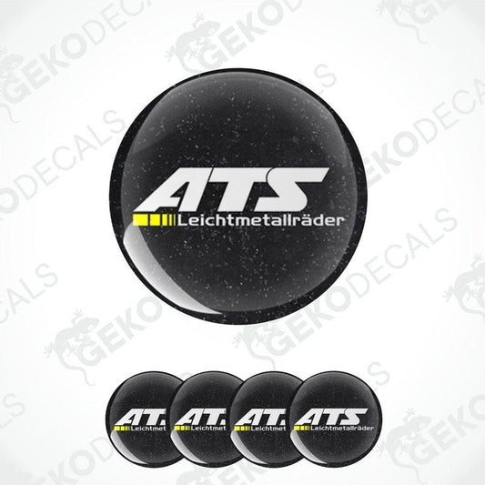 A set of four black round car decals with the ATS Leichtmetallräder logo in white and yellow.