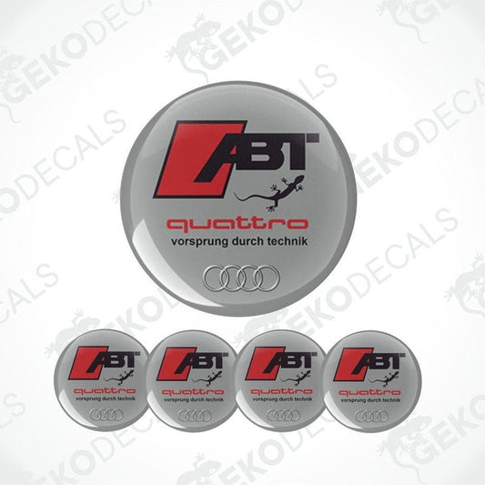 Set of four Audi ABT Quattro wheel decals with a silver, red, and black color scheme and the text 'quattro' and 'vorsprung durch technik'.
