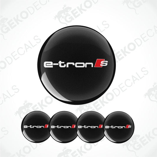 A set of four black vinyl stickers with the text 'AUDI E-TRON S' in white and red, intended for use on car wheels.