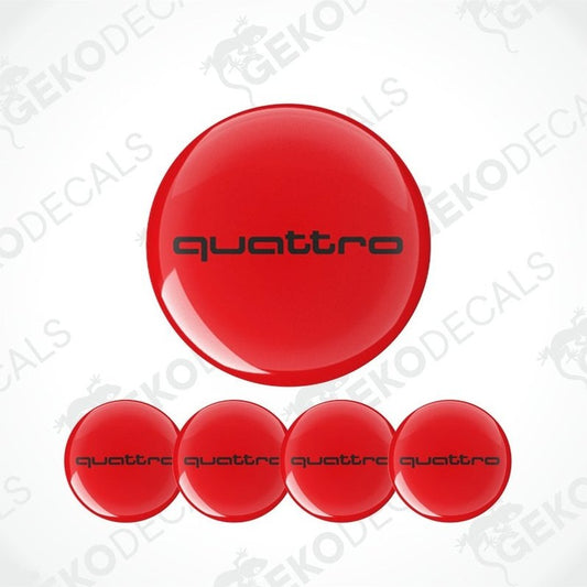 A set of four red vinyl decals with 'quattro' branding, typically used as car wheel stickers.