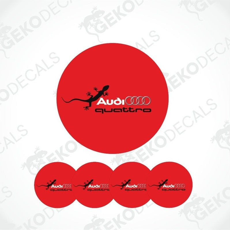 A set of red vinyl decals with the Audi Quattro logo, including one larger decal and four smaller ones arranged in a row.
