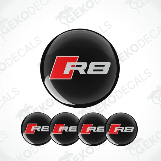A set of four black vinyl stickers with the word 'AUDI R8' in red and white, displayed on a white background.