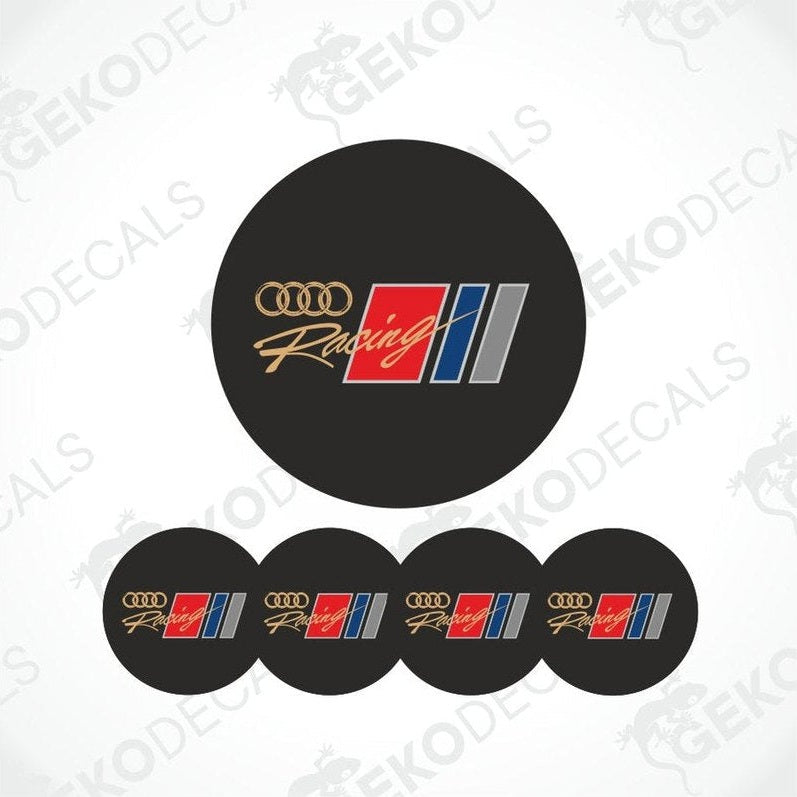 A set of four black vinyl stickers with the AUDI RACING logo in white, red, blue, and silver colors.