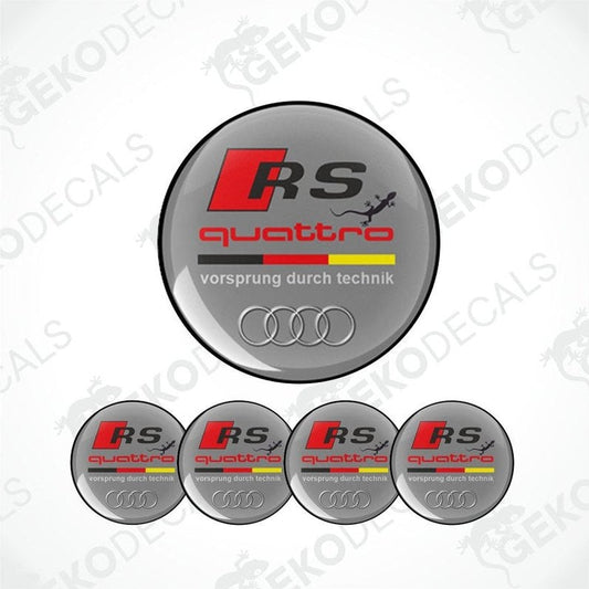 A set of four circular car decals with a 'RS quattro' design, predominantly gray with red and yellow accents, and the Audi logo.