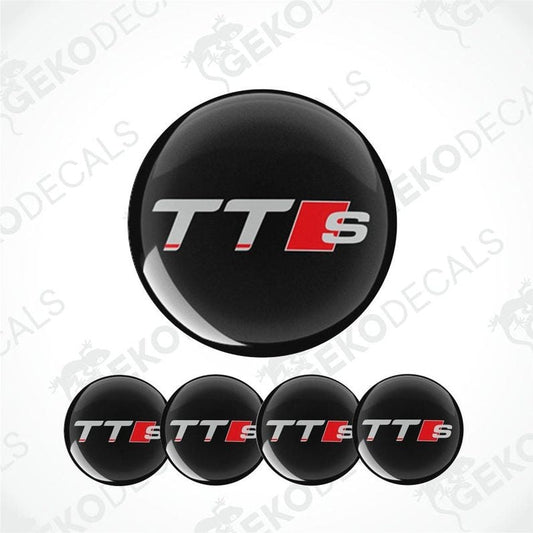 A set of four black vinyl stickers with the Audi TT S LINE logo in red and white.