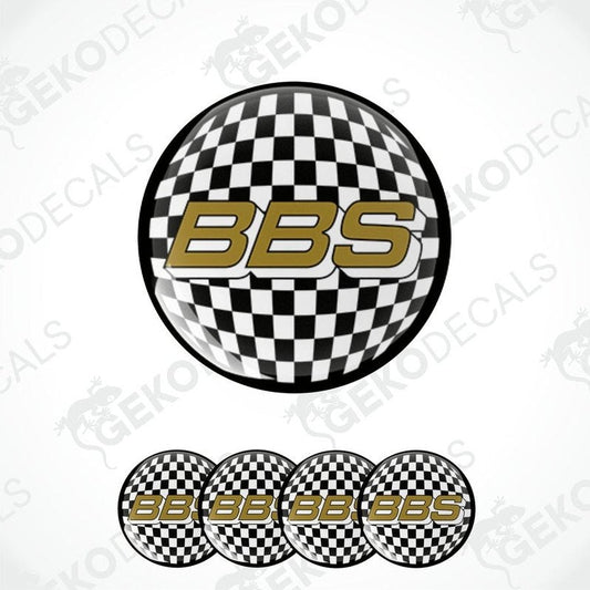 A set of four vinyl decals with a polyurethane coating featuring a checkered black and white design and the letters 'BBS' in gold.