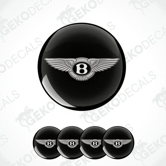 A set of black vinyl decals with a silver Bentley logo, intended for use on a vehicle's wheels.