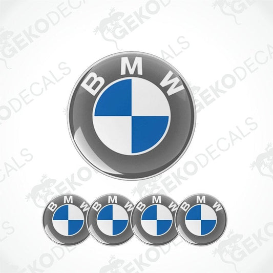 A set of four silver BMW emblem stickers with a blue and white design on a GeckoDecals background.