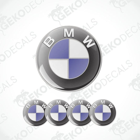 A set of four BMW emblem stickers, with the BMW logo in the center, placed on a white background. The stickers are designed to be applied on car wheels.
