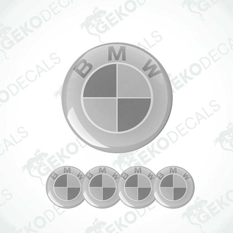 A set of four round car stickers with a gray background and a light and dark gray BMW logo.
