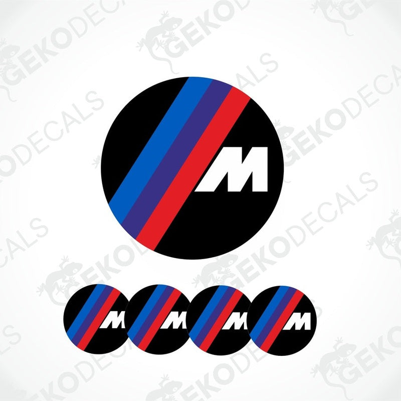 A set of four round vinyl stickers with a black center featuring a red and blue stripe and the letter ' BMW M' on a white background.