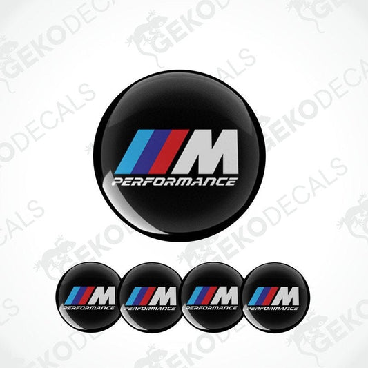 A set of four black vinyl stickers with the BMW M PERFORMANCE logo in red and white.