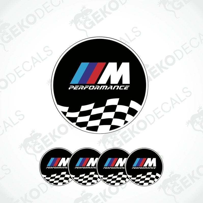 A set of four black vinyl stickers with the BMW M PERFORMANCE logo in white. The stickers have a checkered pattern with a white border and the BMW logo in the center.