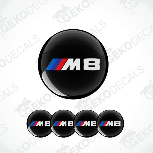 A set of four round car decals with a black background featuring the 'M8' logo in white and red.