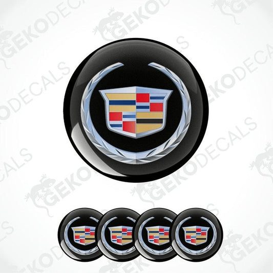 A set of four black round car decals with the Cadillac logo in the center.