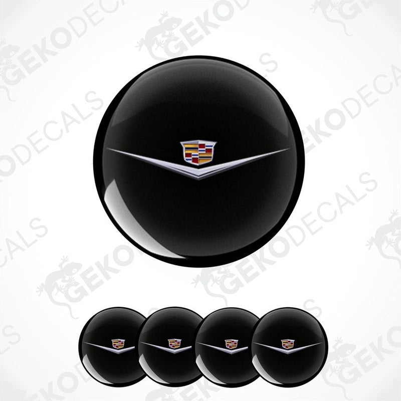 Set of four black vinyl decals with a Cadillac logo applied on them, designed for use as car wheel caps.