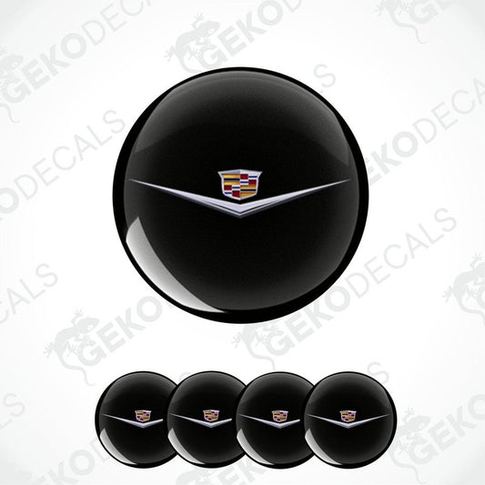 Set of four black vinyl decals with a Cadillac logo applied on them, designed for use as car wheel caps.