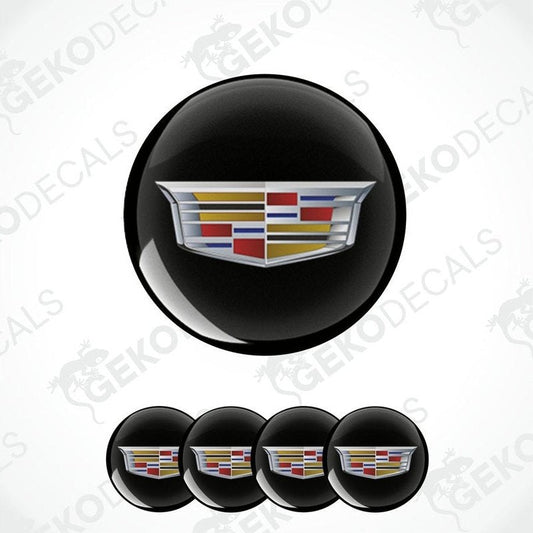 Set of four black vinyl decals with a Cadillac logo applied on them, designed for use as car wheel caps.