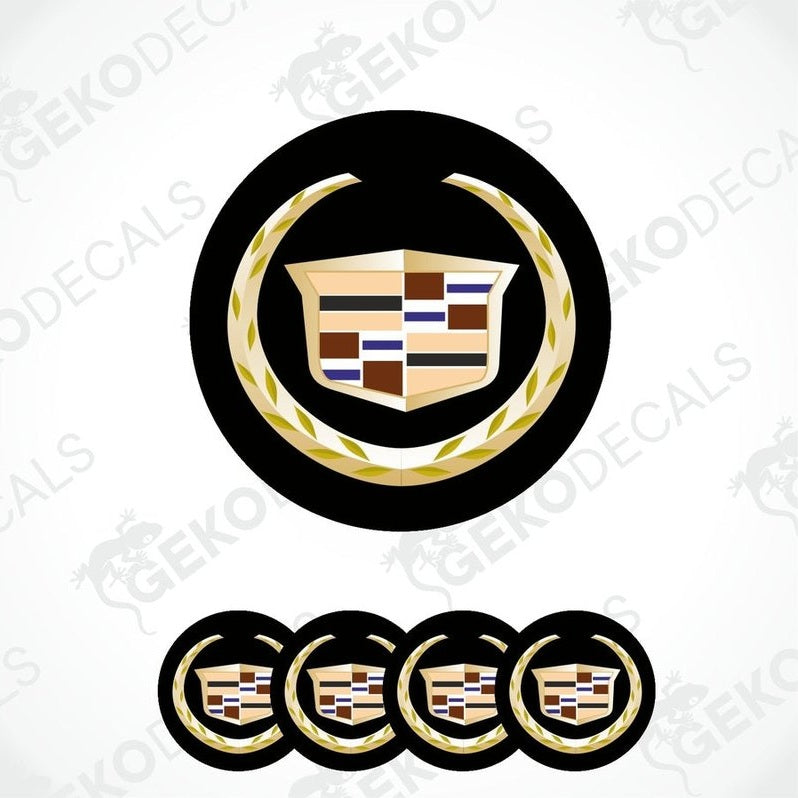 A set of four vinyl decals with a Cadillac logo design, featuring a black background with gold and multicolor accents.