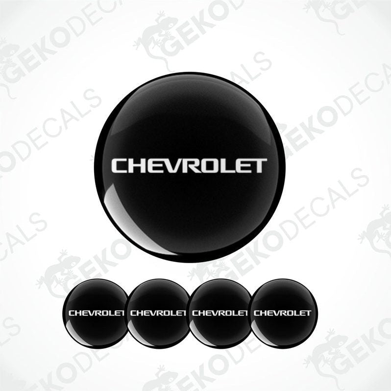 A set of four black vinyl stickers with the word 'CHEVROLET' printed on them, arranged in a stack with the top sticker being the largest and the others progressively smaller.