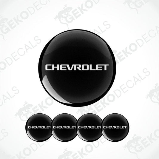 A set of four black vinyl stickers with the word 'CHEVROLET' printed on them, arranged in a stack with the top sticker being the largest and the others progressively smaller.