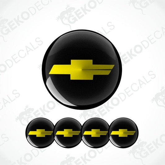 A set of four black vinyl stickers with a yellow Chevrolet logo on them.