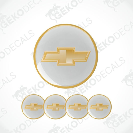 A set of five vinyl decals with polyurethane coating featuring the CHEVROLET logo, in gold and white colors, designed for use on car wheels.