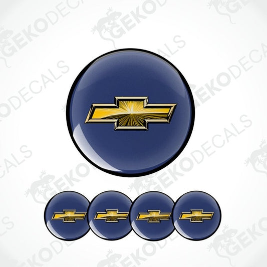 A set of four blue vinyl decals with a gold Chevrolet logo, designed for use on car wheels or caps.