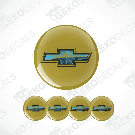 A set of four gold-colored vinyl stickers with the Chevrolet logo in the center.