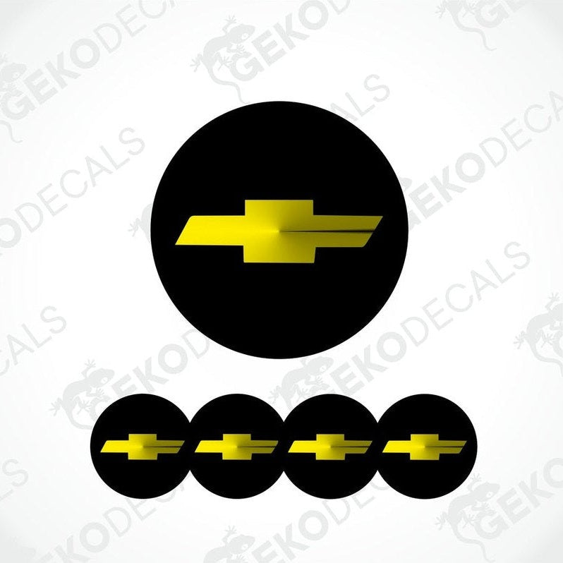 A set of four black vinyl stickers with a yellow Chevrolet logo on them.