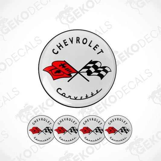 A set of four circular vinyl decals with the Chevrolet Corvette logo, including one with a red flag design.