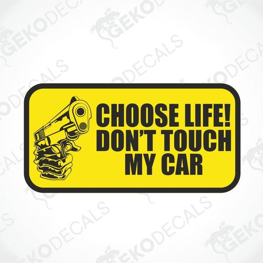 A rectangular yellow car sticker with black text and graphic of a gun, saying 'CHOOSE LIFE! DON'T TOUCH MY CAR'.