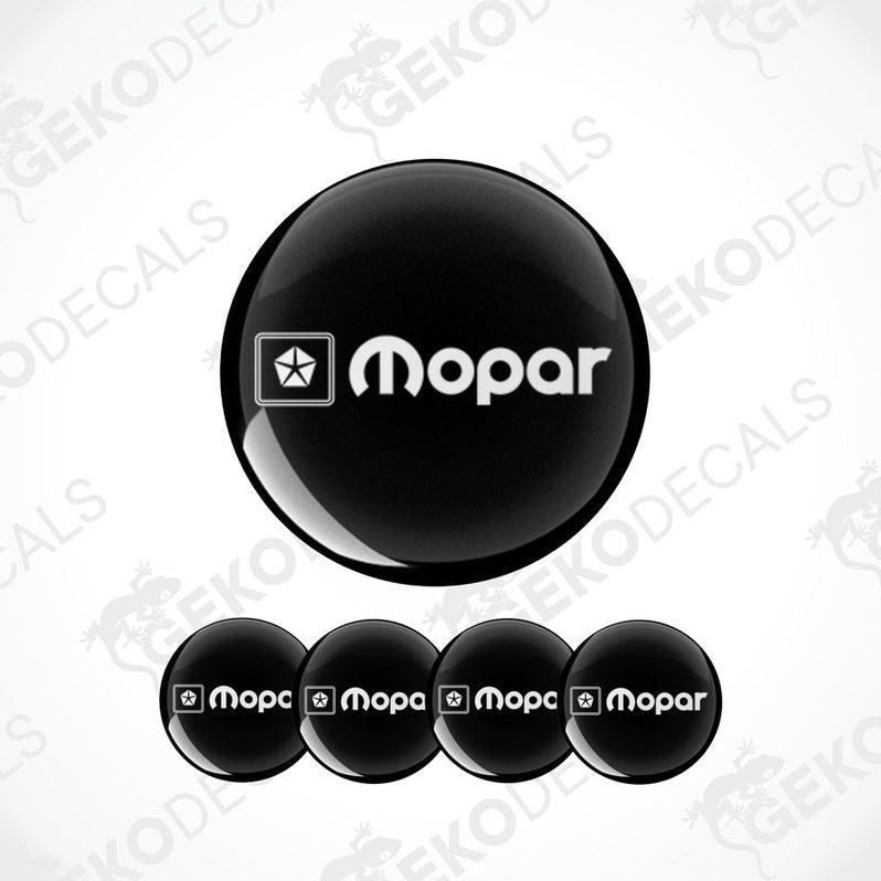A set of four black and white vinyl decals with the MOPAR logo.