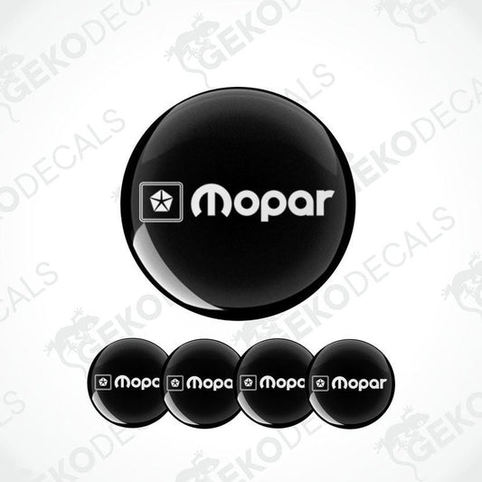 A set of four black and white vinyl decals with the MOPAR logo.