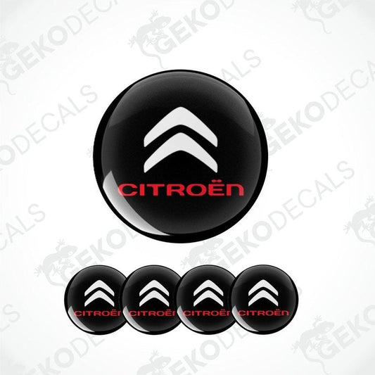 A set of black and white vinyl decals with the CITROEN logo, intended for use as car wheel caps and stickers.