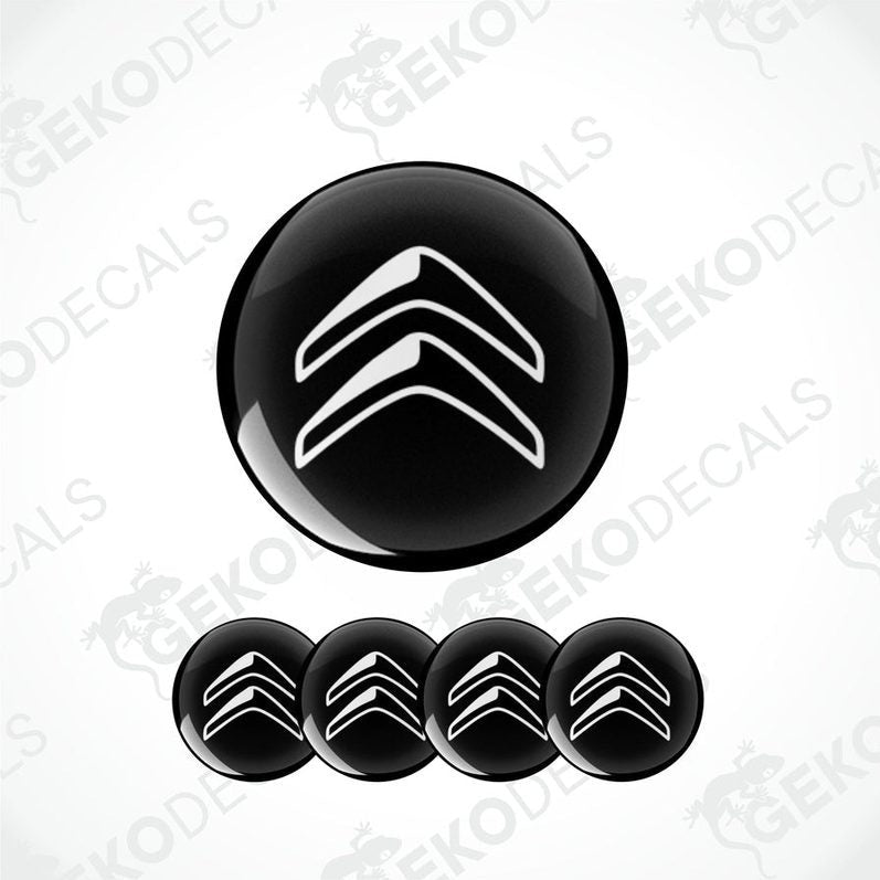 A set of four black vinyl stickers with a white chevron pattern, designed to be applied on car wheels or caps.
